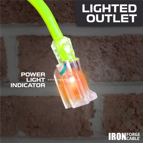 Weatherproof 100 Ft Outdoor Extension Cord with Lighted End close-up on brick background, showing power light indicator.