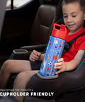 Child holding Disney Princess 14oz Kids Water Bottle With Straw Lid Insulated Stainless Steel Tumbler, cupholder friendly design.
