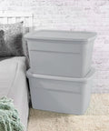 Six Pack Heavy Duty 30 Gallon Plastic Storage Containers With Secure Lids Hella Roomy Gray Bins stacked beside bed in bedroom.