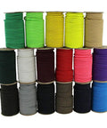 Various colored spools of heavy duty marine grade bungee cord stacked, showcasing multiple hues for DIY tie-downs and commercial use.