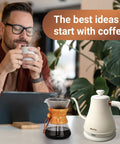 Man enjoying coffee near Stainless Steel Gooseneck Electric Kettle for Pour Over Coffee, Fast 1000W Heating, Auto Shut Off, 27 Fl Oz Milk White