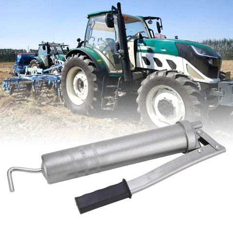 High Pressure Grease Gun 8000 PSI 400cc Manual Oiling Greaser in front of tractors on a field