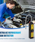 Automotive AC leak detector with flexible metal probe and yellow handheld unit under car hood