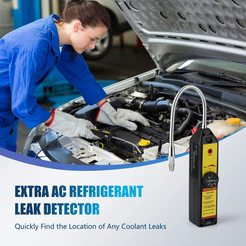 Automotive AC leak detector with flexible metal probe and yellow handheld unit under car hood