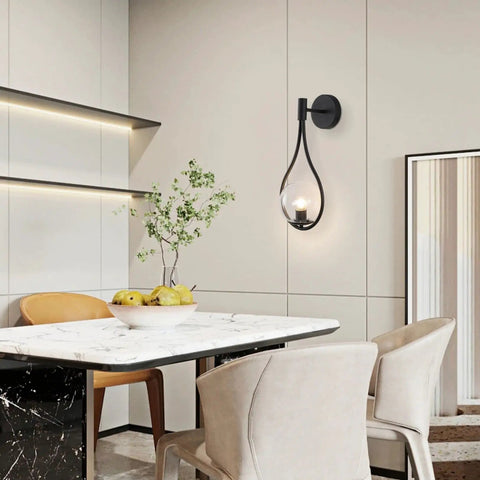 Dining room with Industrial Vintage Matte Black Globe Wall Sconce Set of 2 With Clear Hand Blown Glass Shades on wall