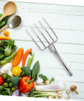Small Stainless Steel Garden Fork For Ladies with vegetables, lightweight digging fork for planting and kitchen tasks on table.