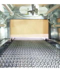 No Nonsense Heavy Duty 220V Heat Shrink Tunnel Machine Featuring Quartz Infrared Tubes, view of conveyor with metallic surface.