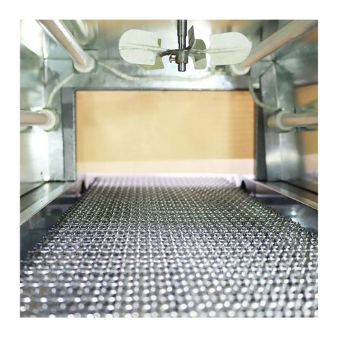 No Nonsense Heavy Duty 220V Heat Shrink Tunnel Machine Featuring Quartz Infrared Tubes, view of conveyor with metallic surface.