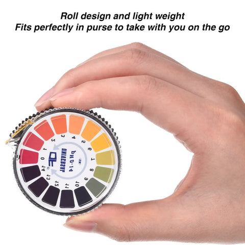 Hand holding Universal PH Test Paper Strips Roll Kit With Full Range 0 To 14, 16.4 Ft Per Roll, color chart visible