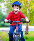 Child riding a bike using Kids Bicycle Brake Levers Set, Easy Install Brake Handles for Kids Bikes on 2.3 cm handlebar.