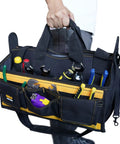 Person holding 17 Inch Open Top Electrician Tool Bag With Shoulder Strap HVAC Pro Carrier Center Plastic Tray 30 Pockets Dual Outside Pouches