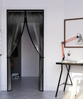 Two Piece Zipper Dust Barrier Door Kit 48 By 87 Inch Easy Install Temporary Wall Screen in home doorway, black edges visible