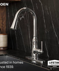 Moen Jaslynn Pulldown Kitchen Faucet, Chrome, 87618 installed on a dark countertop with sleek design.