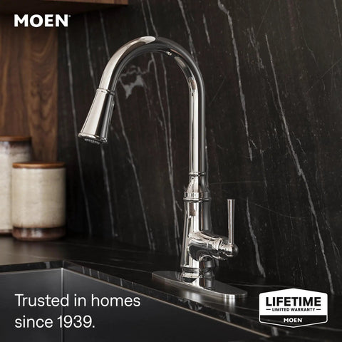 Moen Jaslynn Pulldown Kitchen Faucet, Chrome, 87618 installed on a dark countertop with sleek design.