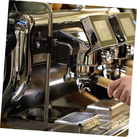 Commercial coffee machine with steam wand rubber sleeve in use, emphasizing accessories kit and pipe insulation.