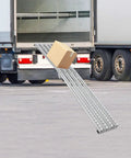 Foldable Unpowered Conveyor Roller Table Made To Last, Heavy Duty PE Belt With Four Rows Of Wheels For Warehouse Loading Dock And Factory, 78.74 Inches Long in use to load a package into a truck.