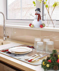 Holiday Themed Snowman Wood Grain Dish Drying Mat 16 By 18 Inches under glassware near sink with snowman decor