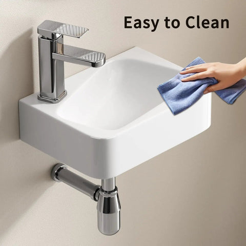 HAOCHRYSYPH Ceramic Wall Mount Bathroom Sink, Milk White, 14.18x10.24 in. being wiped clean with a cloth.