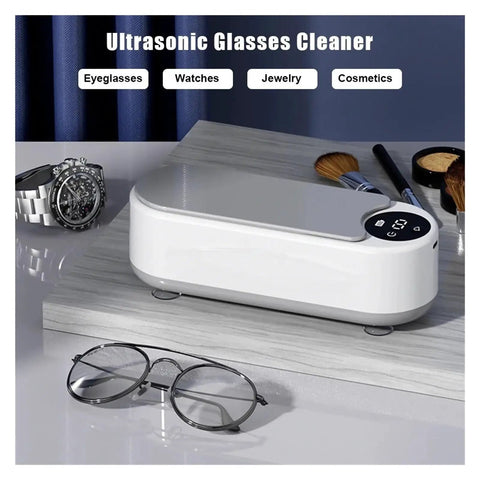 Totally Slick Portable Ultrasonic Cleaner For Sparkling Jewelry And Flawless Eyeglasses Hella Efficient Rechargeable Cleaning Pod For Retainers And Watches You Are Gonna Love on a wooden surface with eyeglasses and a watch nearby.