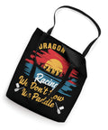 Black Dragon Boat Paddler Tote Bag with colorful paddling graphic and text 'We Don't Row We Paddle' for race day gear.