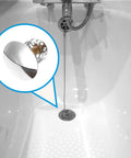 Bathtub Plug Replacement Copper Round Slotted Push Button Waste shown in a bathtub, highlighting its shiny surface and modern design.