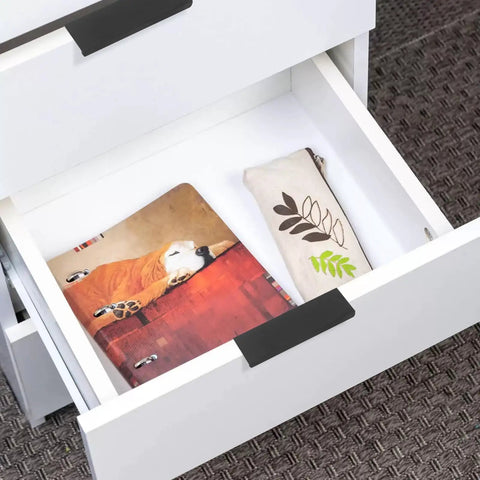 30 Pack Black Cabinet Handles Modern Drawer Pulls for Kitchen and Bath attached to a sleek white drawer