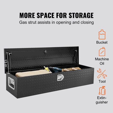 Road Ready Heavy Duty Aluminum Truck Bed Toolbox Featuring Diamond Plate Shield And Tamper Proof Latching For Rough Daily Runs And Tailgate Chasing 48 Inch Black Storage Case with items inside.