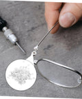 Close-up of 200 Pcs Optical Gaskets For Eyeglasses Repair Rimless Eyewear Washers with screwdriver and eyeglasses on table