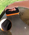 Hand using Ultimate Griddle Cleaning Kit For Flat Top Grill 18 Piece Cleaner Set With Scraper on griddle surface