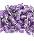 Pile of purple Personalized Pigeon Racing Bands Set, 100 Pcs 8mm Colorful Leg Rings With Loft Name, Year And Unique Number