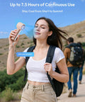 Woman hiking with Compact Handheld Personal Fan With Turbo Wind On The Go USB Rechargeable Mini Cooler For Travel and Outdoors