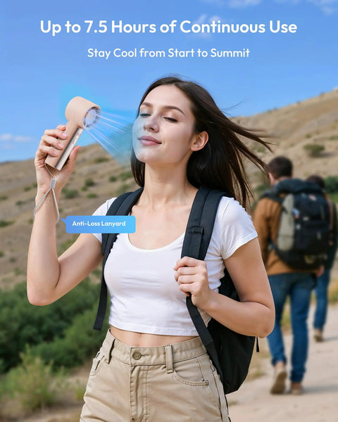 Woman hiking with Compact Handheld Personal Fan With Turbo Wind On The Go USB Rechargeable Mini Cooler For Travel and Outdoors