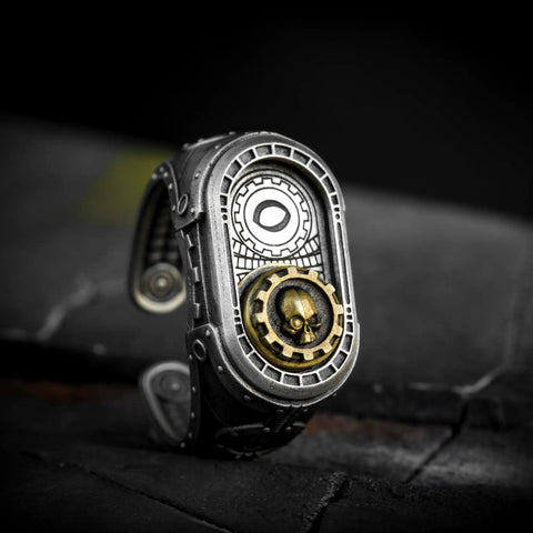Straight Up Premium Warhammer 40K Adeptus Mechanicus Cipher Of The Machine God Ring For Men Gold Plated 925 Sterling Silver Gothic Gaming Jewelry With Custom Sizing Options detailed skull gear design on side view.