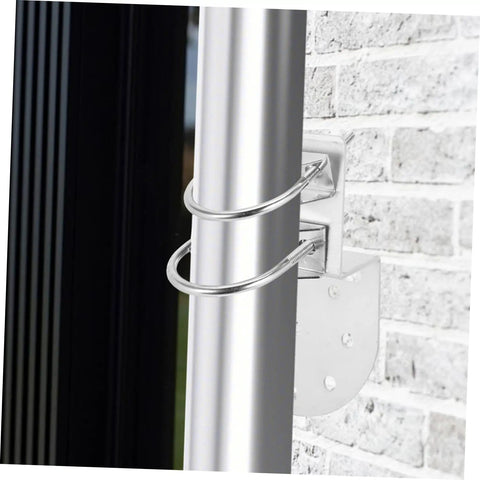 Beefy Iron Antenna Pole Mount Clamp With U Bolts For Wall Or Roof Mounting attached to brick wall
