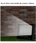 JUDYSSY Solar Flood Light Outdoor, Led Light Solar Flood Light Sensor Solar Pa, Black,80W EU shown in rain against a brick wall.