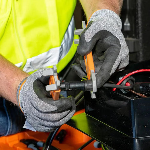 Worker using Solar Panel Insulating Wrench Set For MC4 Style PV Connectors with pro grade steel inserts on rooftop installation.