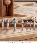 7 Piece 90 Degree V Groove Router Bit Set Featuring Premium Carbide Cutters In Quarter And Half Inch Shanks for engraving and miter joinery.