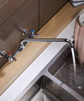Wall Mount Kitchen Faucet With 8 Inch Center Swivel Spout Dual Handle Heavy Duty Pro Grade Chrome Mixer Tap For Laundry And Utility Sinks Easy DIY Installation Restaurant Style Water Faucet installed over a sink