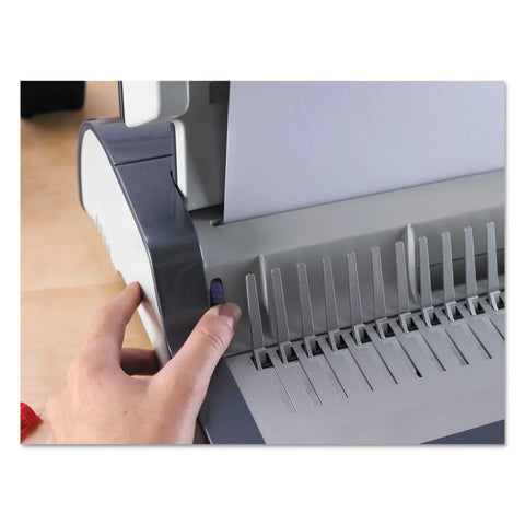 Heavy Duty Electric Comb Binding Machine 20 Sheet Punch For Classroom Organization Bulk Paper Work Starter Kit Included, user adjusting paper alignment.