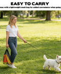 Woman carries Backyard Dog Agility Hurdle Set With Ten 12.5 Inch Cones And Five 31.5 Inch Rods in mesh bag while walking dog