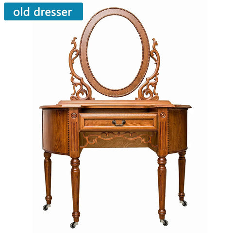Old dresser with ornate mirror and detailed woodwork, featuring smooth roll swivel ball casters with socket mount.