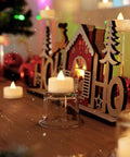 24 Pack Flameless LED Tea Lights Battery Operated Warm White Flickering Mini Candles For Christmas Decor on a festive mantel