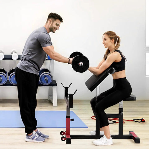 Woman using Heavy Duty Preacher Curl Bench For Home Gym Setup Seated Bicep Curl Station With Barbell And Dumbbell Capability.