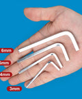 Four Piece L Shaped Square Head Wrench Set With 3mm 4mm 5mm And 6mm Sizes in a hand, showing ergonomic steel wrenches