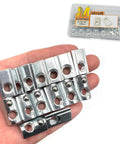 Set Of Fifteen Five Sixteenth Inch Eighteen Thread T Nuts Spring Loaded With Ball Bearings In Silver Zinc Plated Carbon Steel For 4040 Aluminum Extrusions And Slot Eight Systems displayed on hand