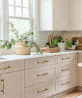 Antique Brass Cabinet Pulls Set Of 6, 7.32 Inch Long With 5.04 Inch Center-To-Center installed on white kitchen drawers.