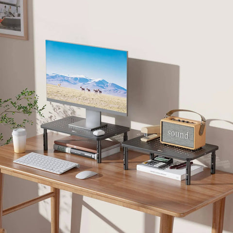 Go To Adjustable Desk Monitor Stand With Laptop Riser And Under Desk Storage, Black metal frame, non-slip rubber pads on wood desk.