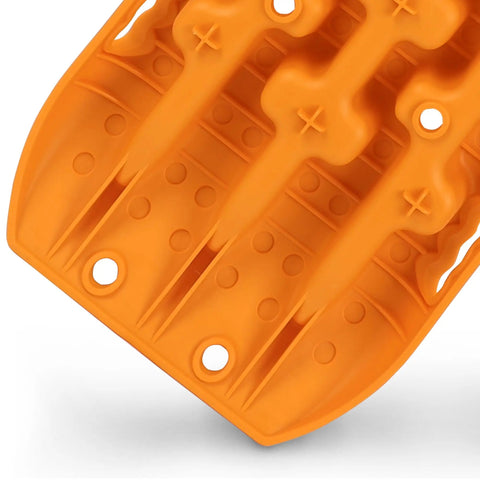 Close-up of orange nylon Beefed Up Off Road Recovery Traction Tracks For Sand Snow Mud 4x4 Vehicles with U shaped grip design.