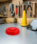 Two Pack Red Abs Ibc Tank Lid Covers With Vent Valves For Easy Pouring Pressure Control Breathable Design on a workbench.