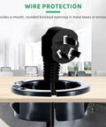 Three Quarters Inch Black Snap In Knockout Insulating Bushing Kit For Wiring Cables And Hoses shown installed in wood panel